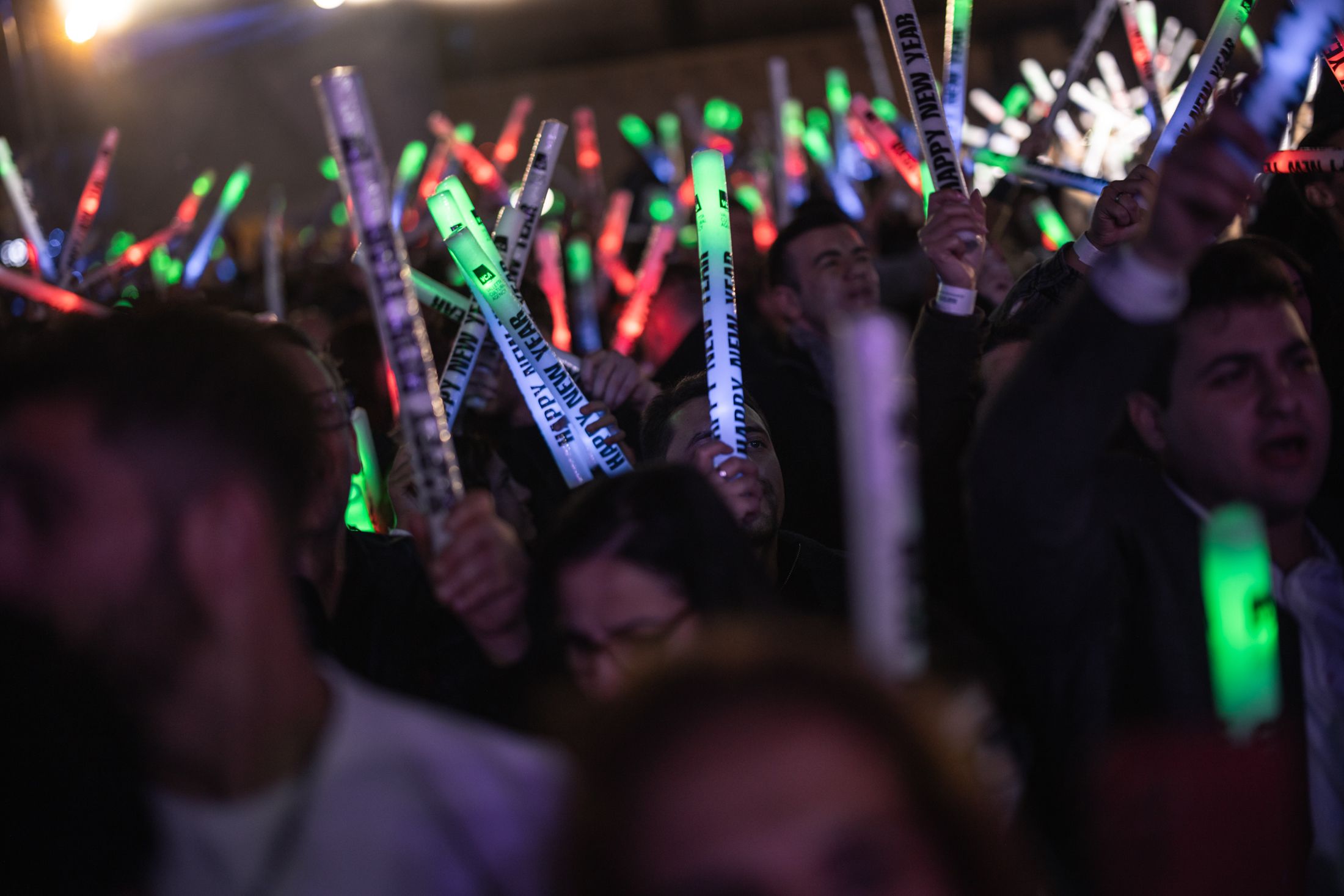 A crowd with light up foam sticks