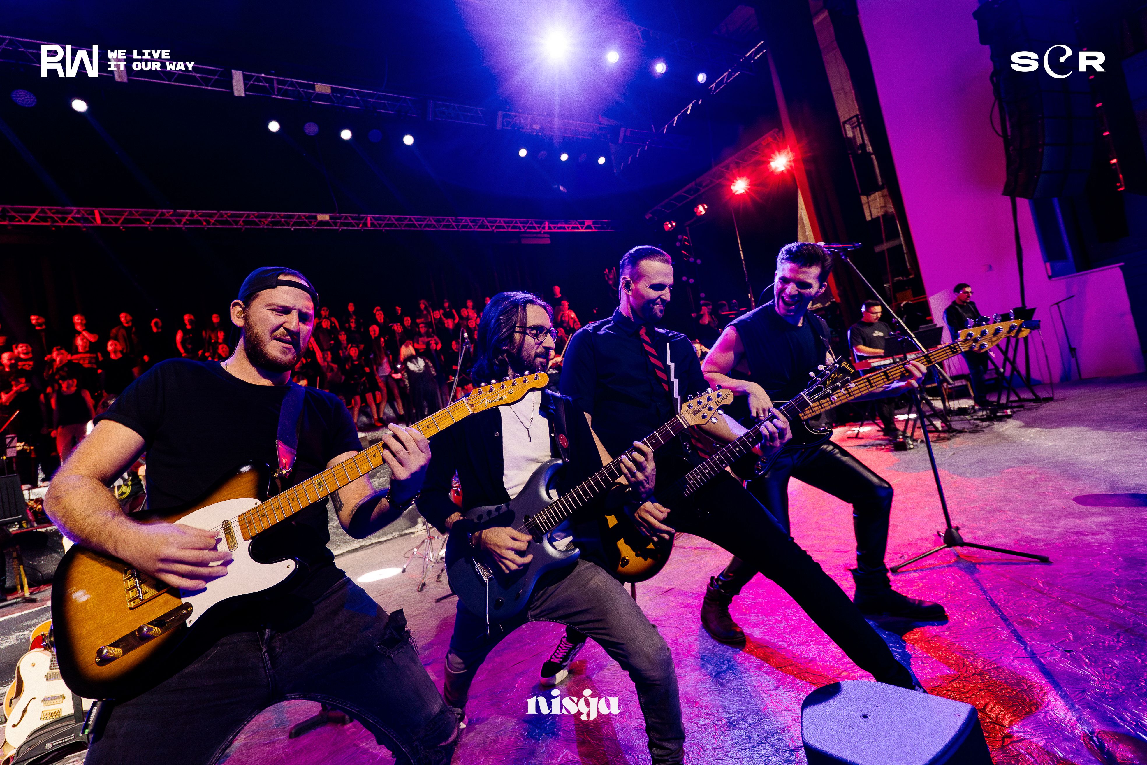 four guitarists having fun