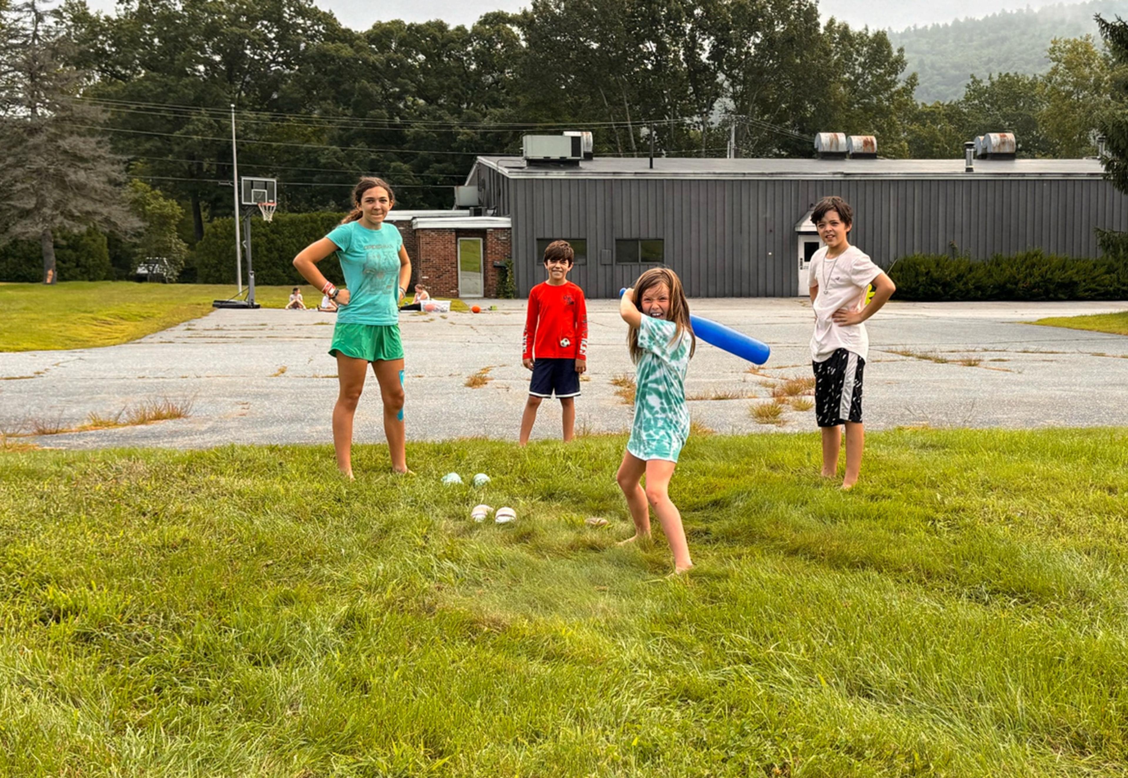 A dozen kids gathered together during summer camp.