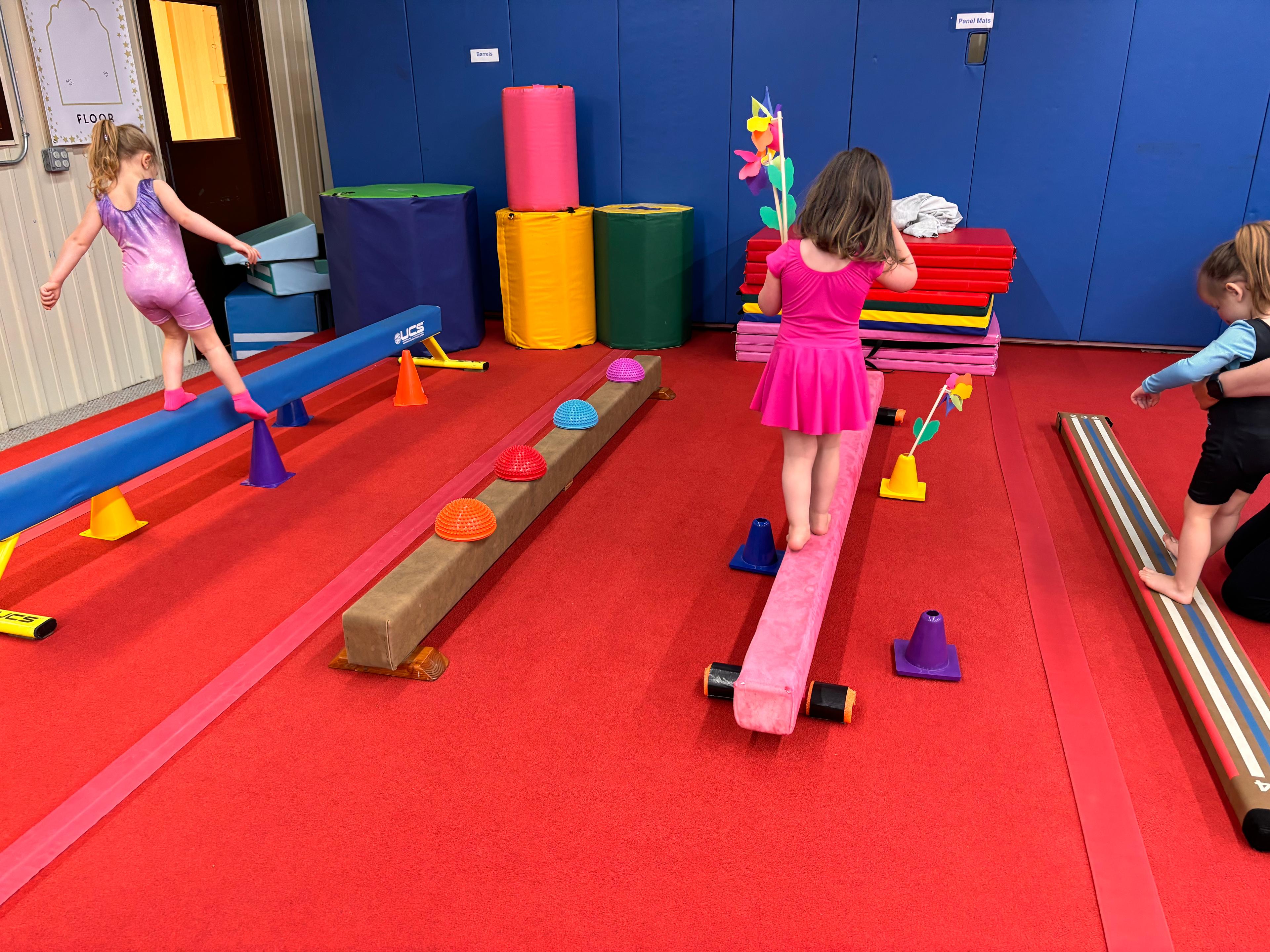 child on balance beam