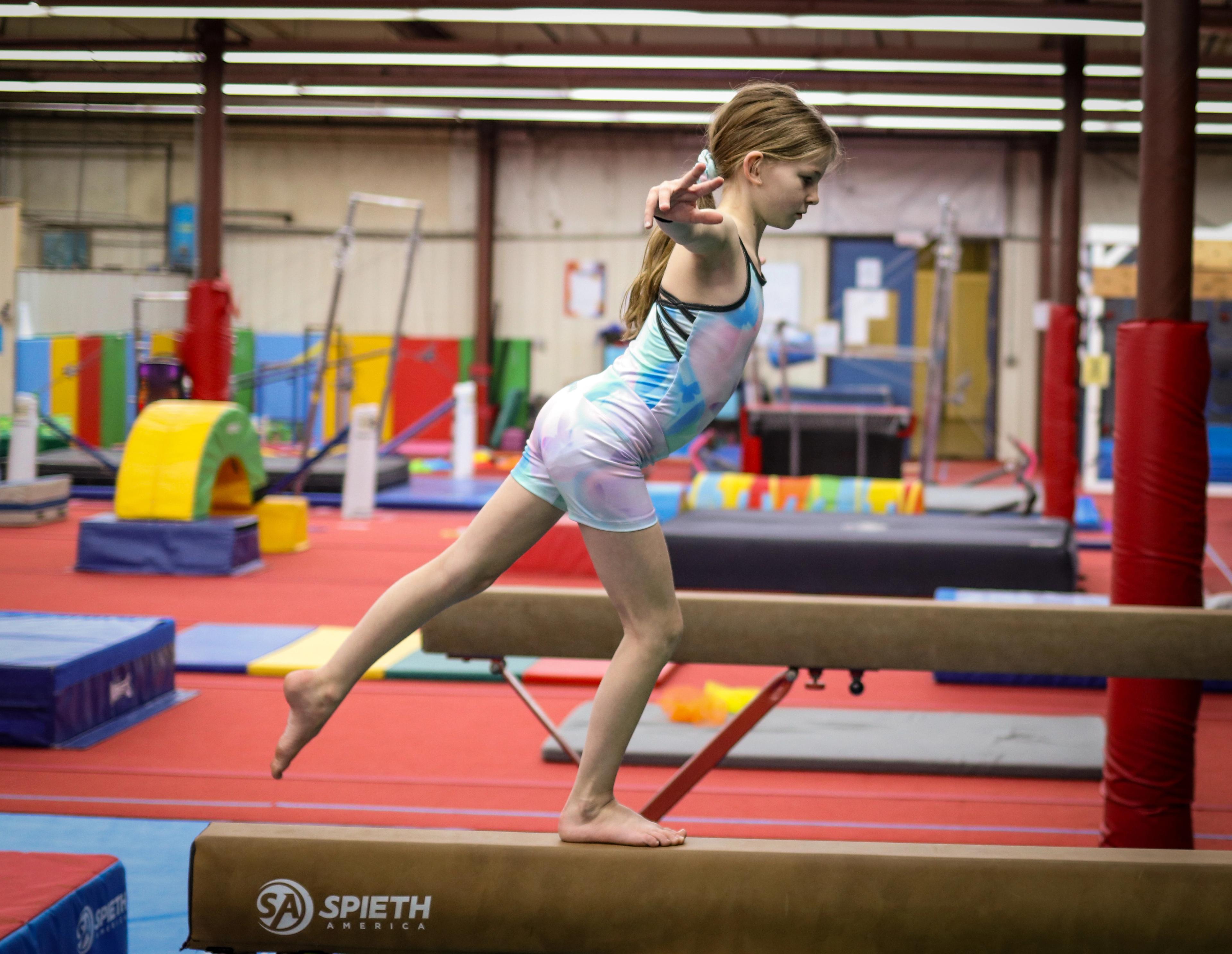 coach spotting athlete