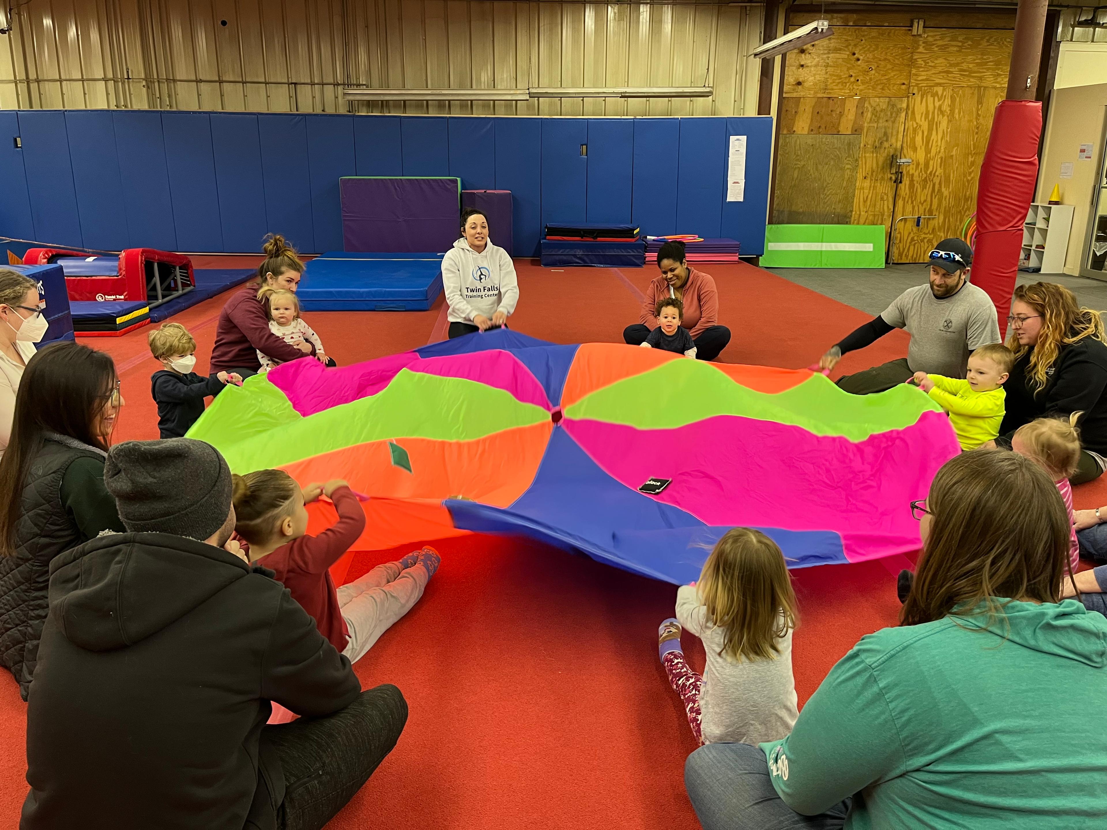 Campers playing with parachute
