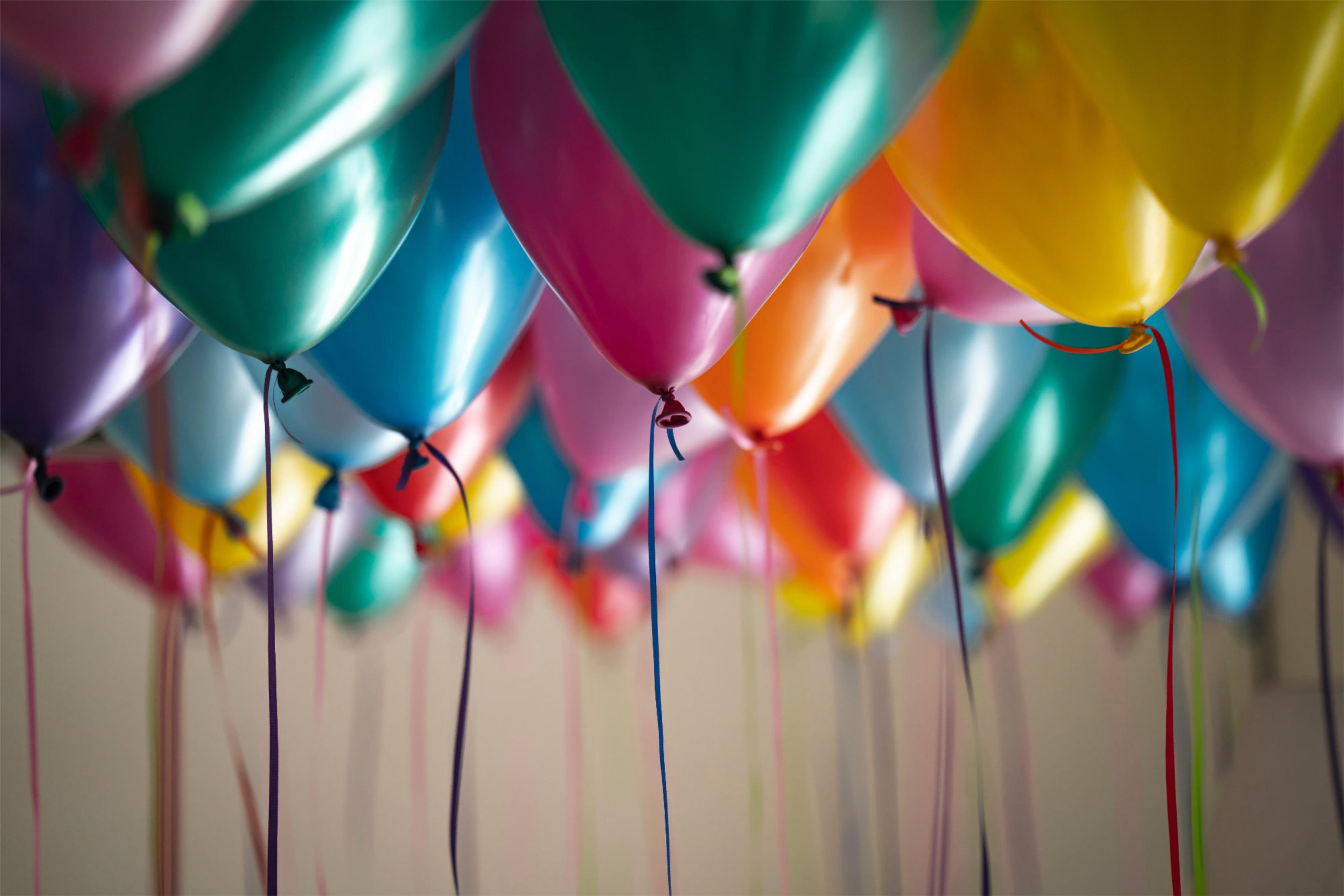 colorful balloons floating to the ceiling