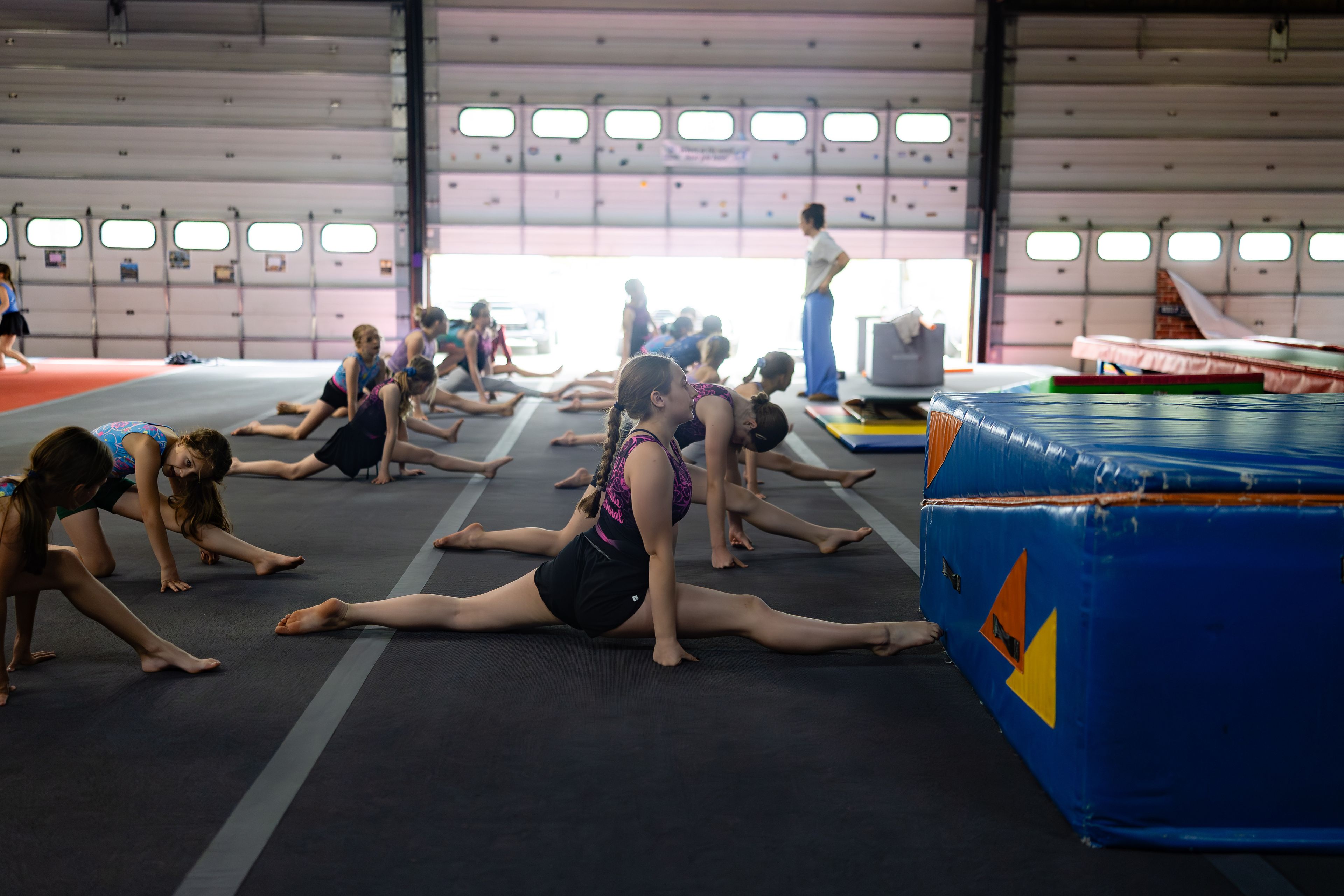 gymnasts stretching in a circle