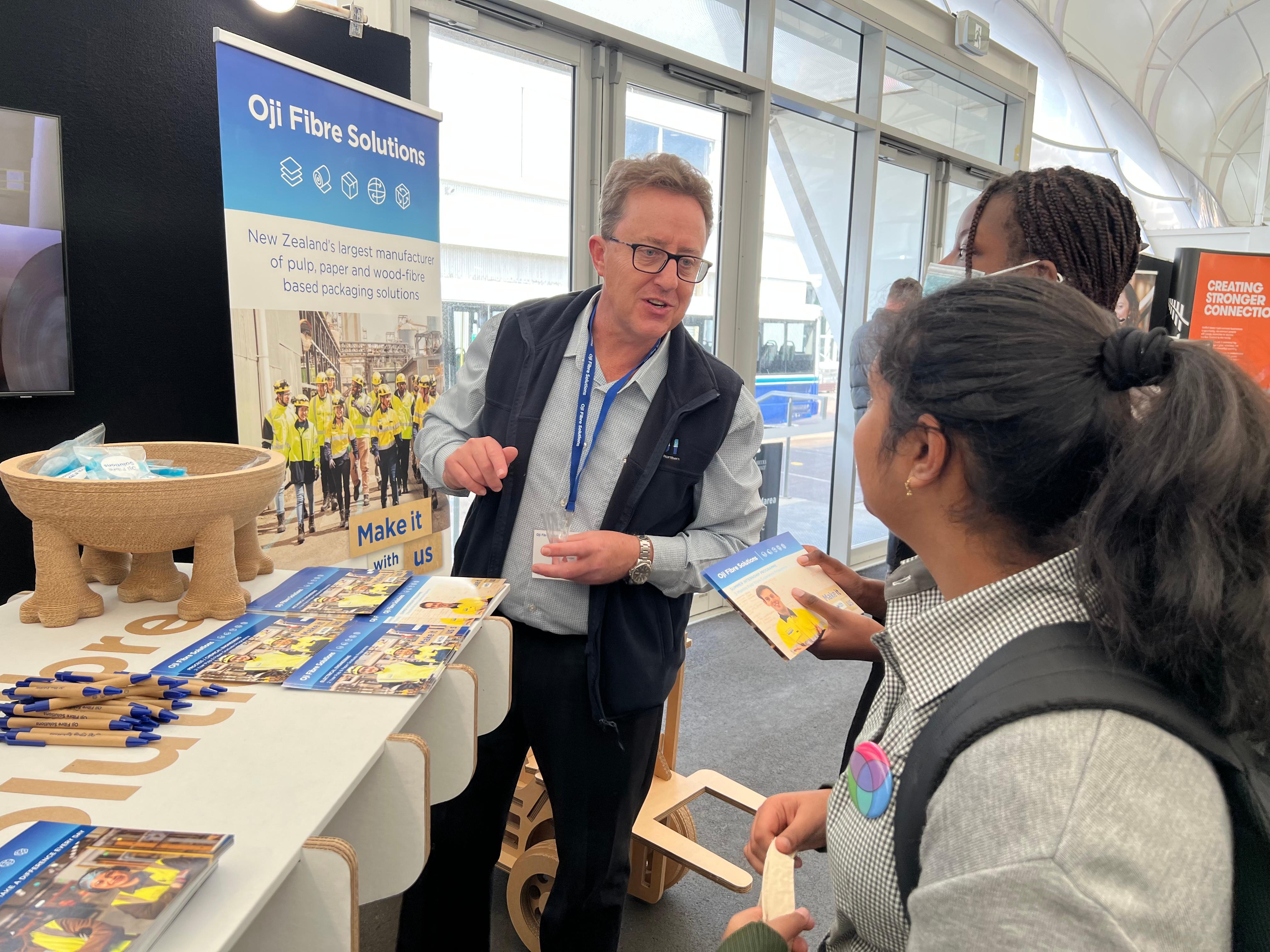 Students visiting OjiFS' Expo Booth