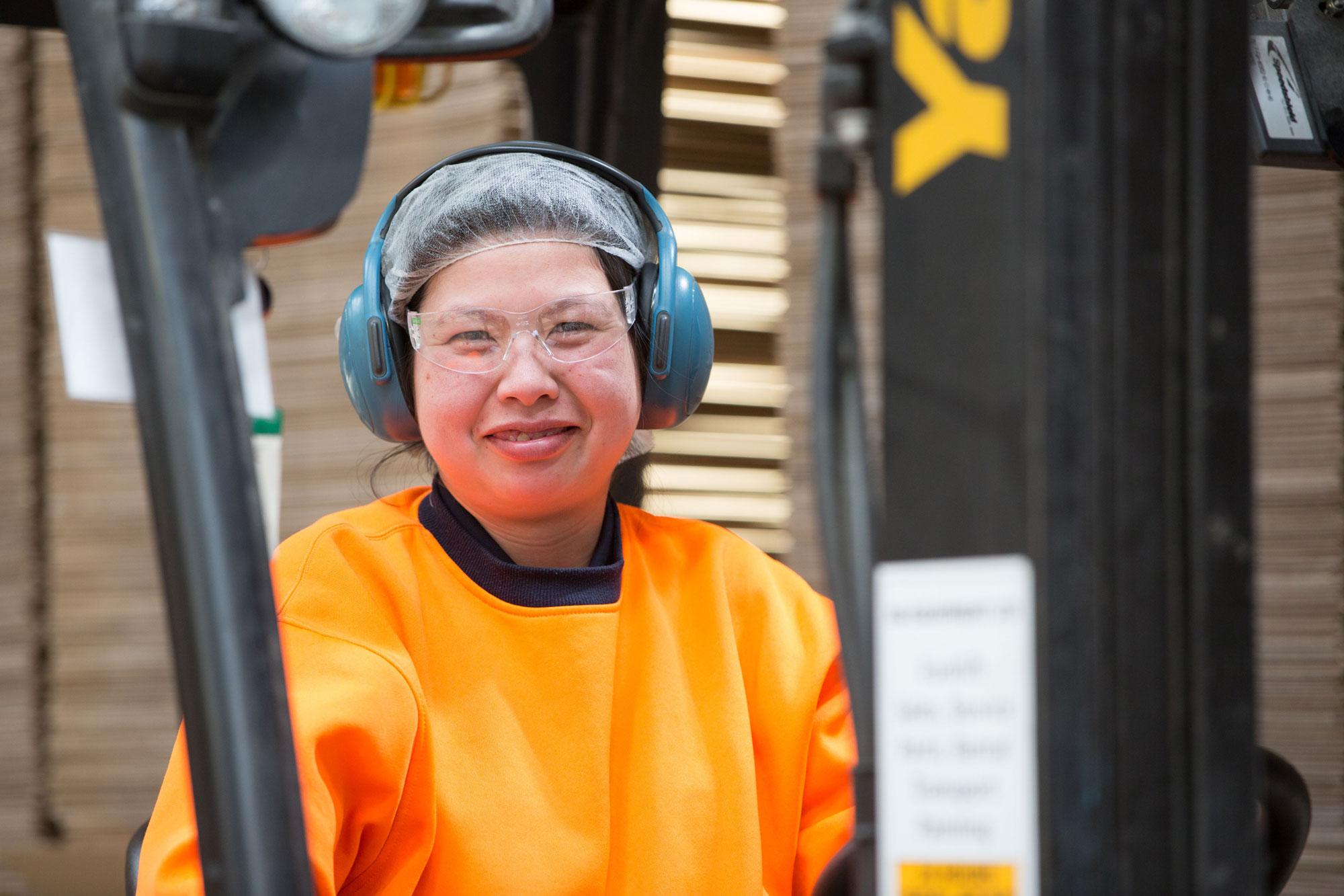 OjiFS employee at the factory