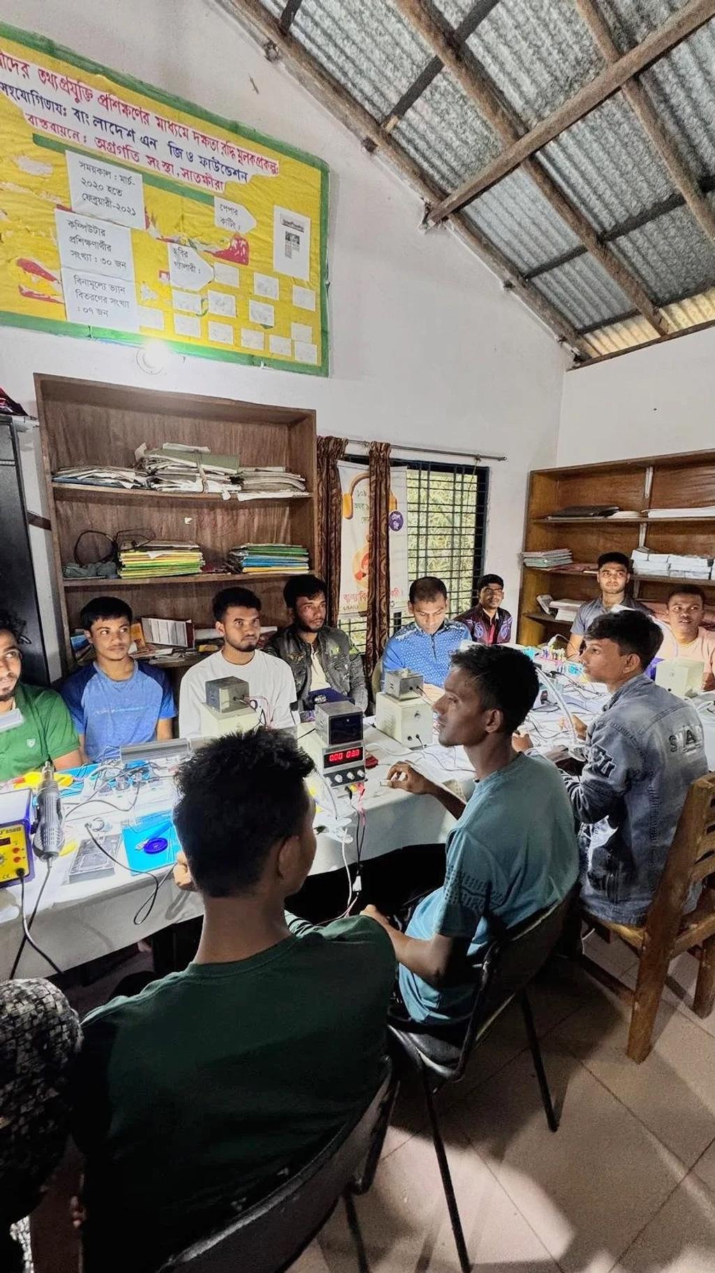 Men being trained around a table