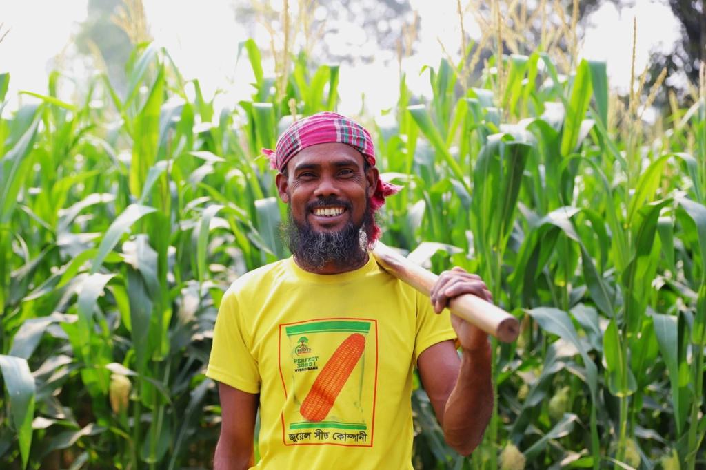 farmer standing in front of crops
