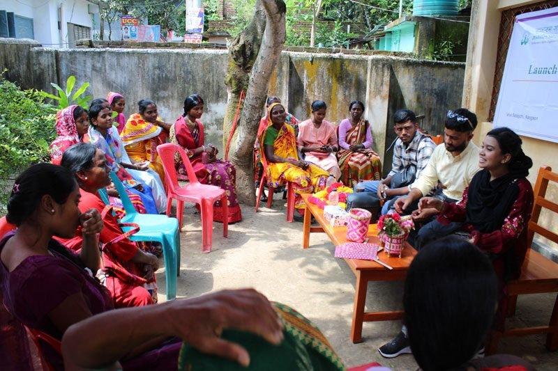 woman sitting around talking through the project