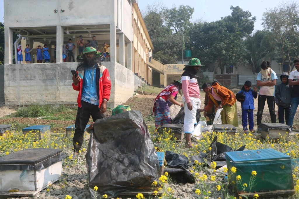 Beekeepers receiving equipment