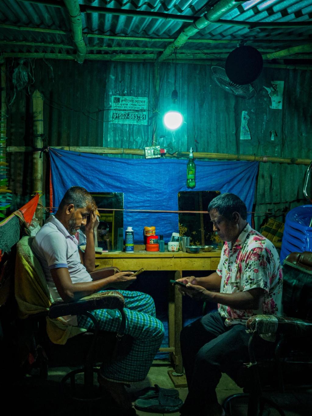 men looking at phones