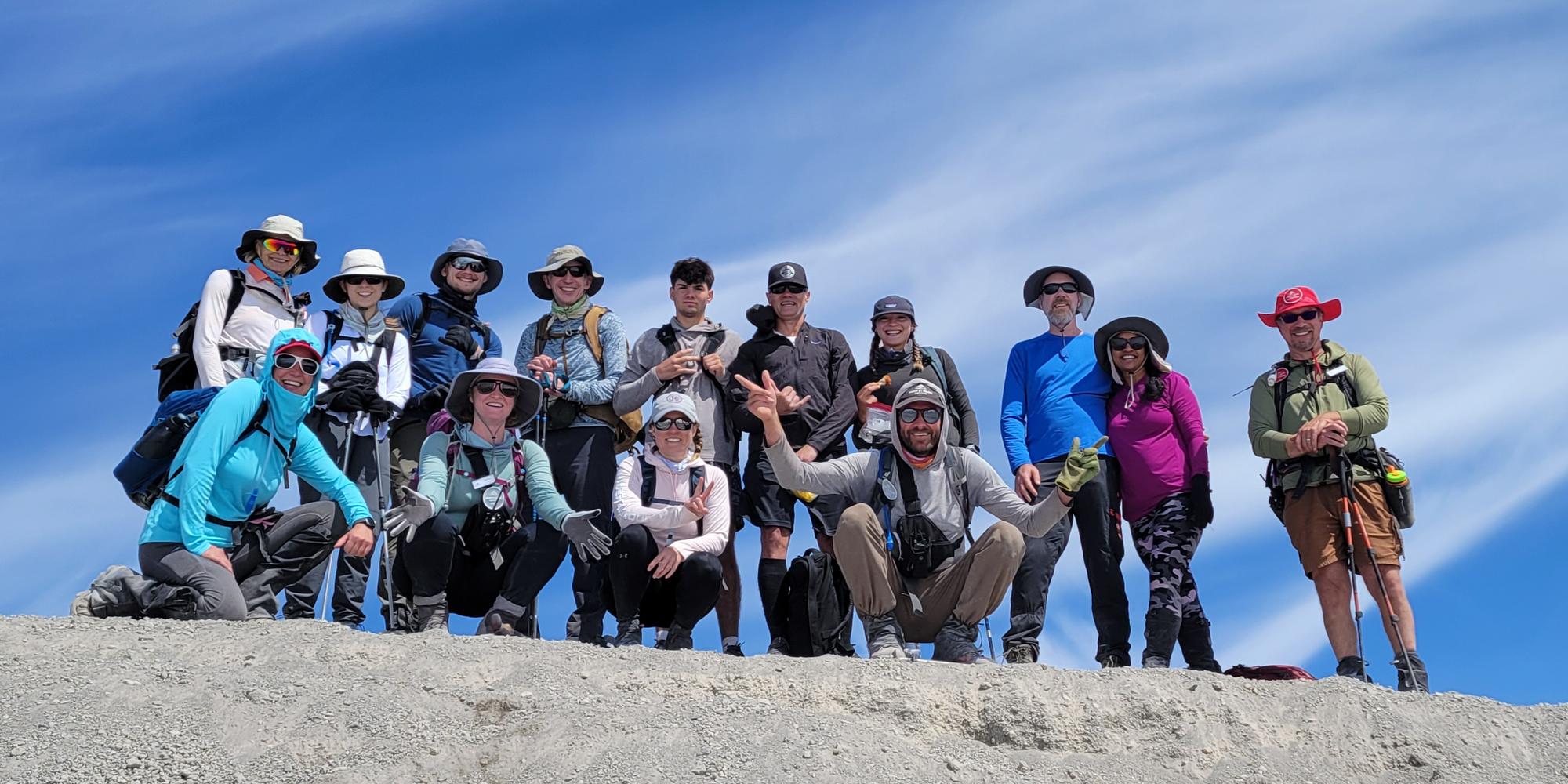 Happy hikers at the summit of a guided climb to the summit of Mount St. Helens