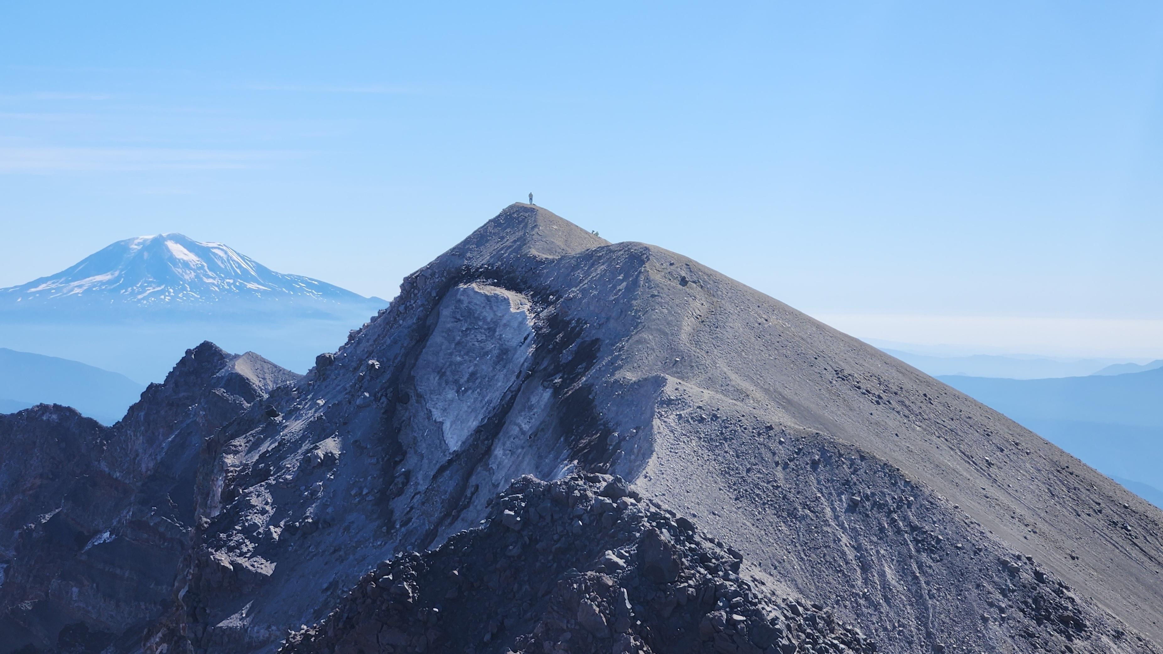 The summit of Mount St. Helens with Mount Adams in the background.