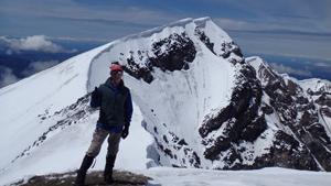 Solo hiker at the summit of Mount St. Helens