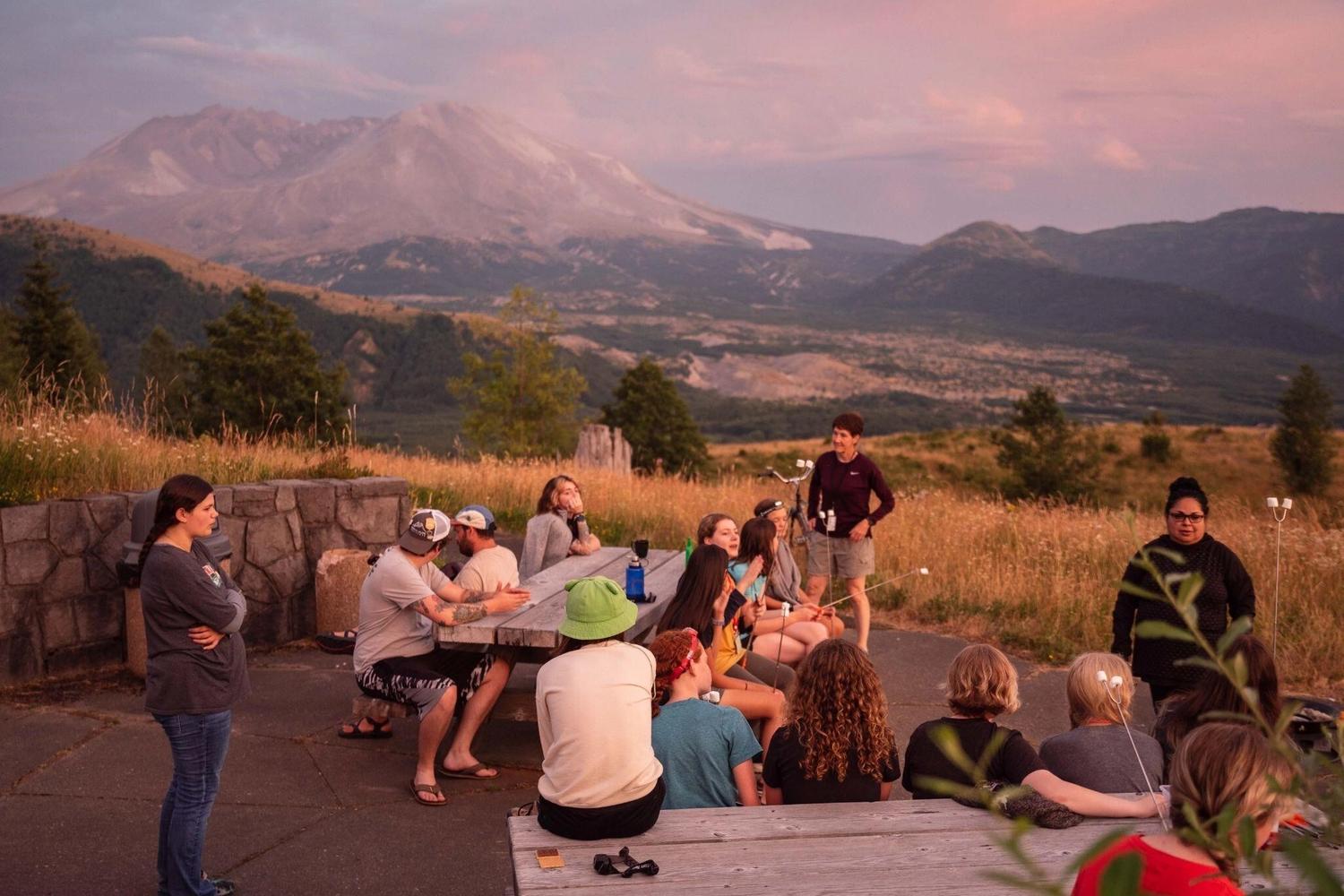 Students enjoying the evening in the shadow of Mount St. Helens at an overnight education program