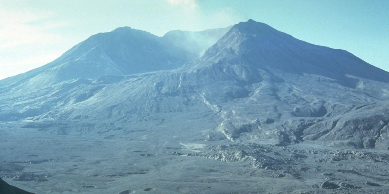 A barren, ash-covered landscape surrounds Mount St. Helens in this post-eruption image.