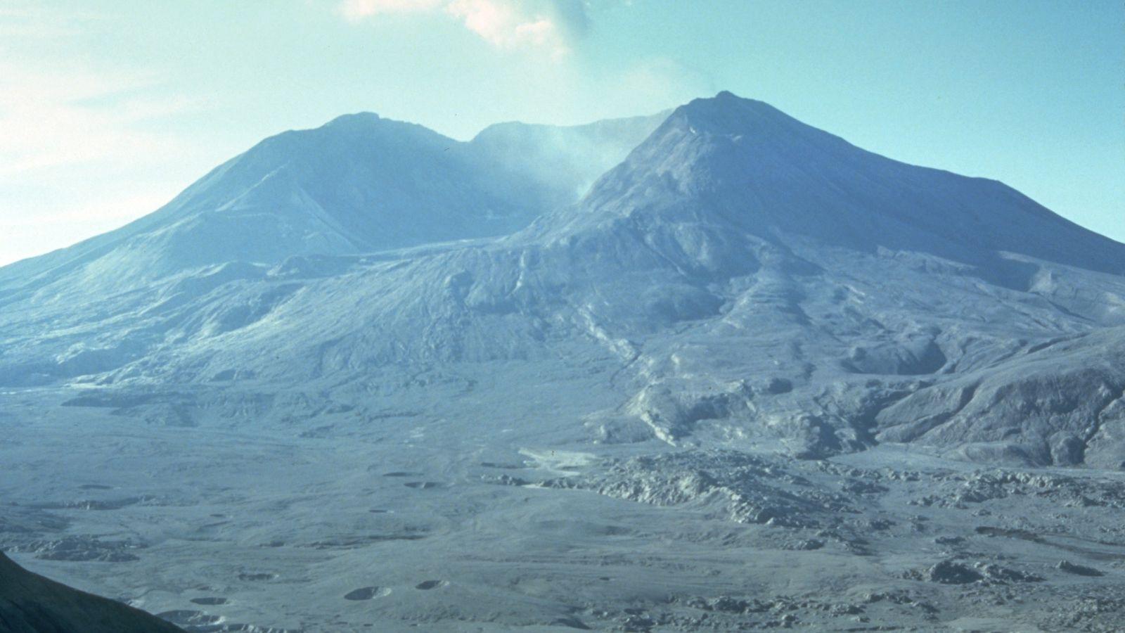 A barren, ash-covered landscape surrounds Mount St. Helens in this post-eruption image.
