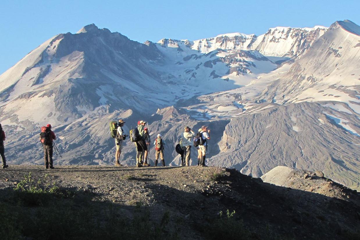 Hikers enjoying the view in front of Mount St. Helens