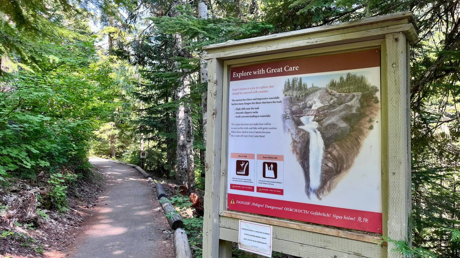 An interpretive signs at the start of a paved trail