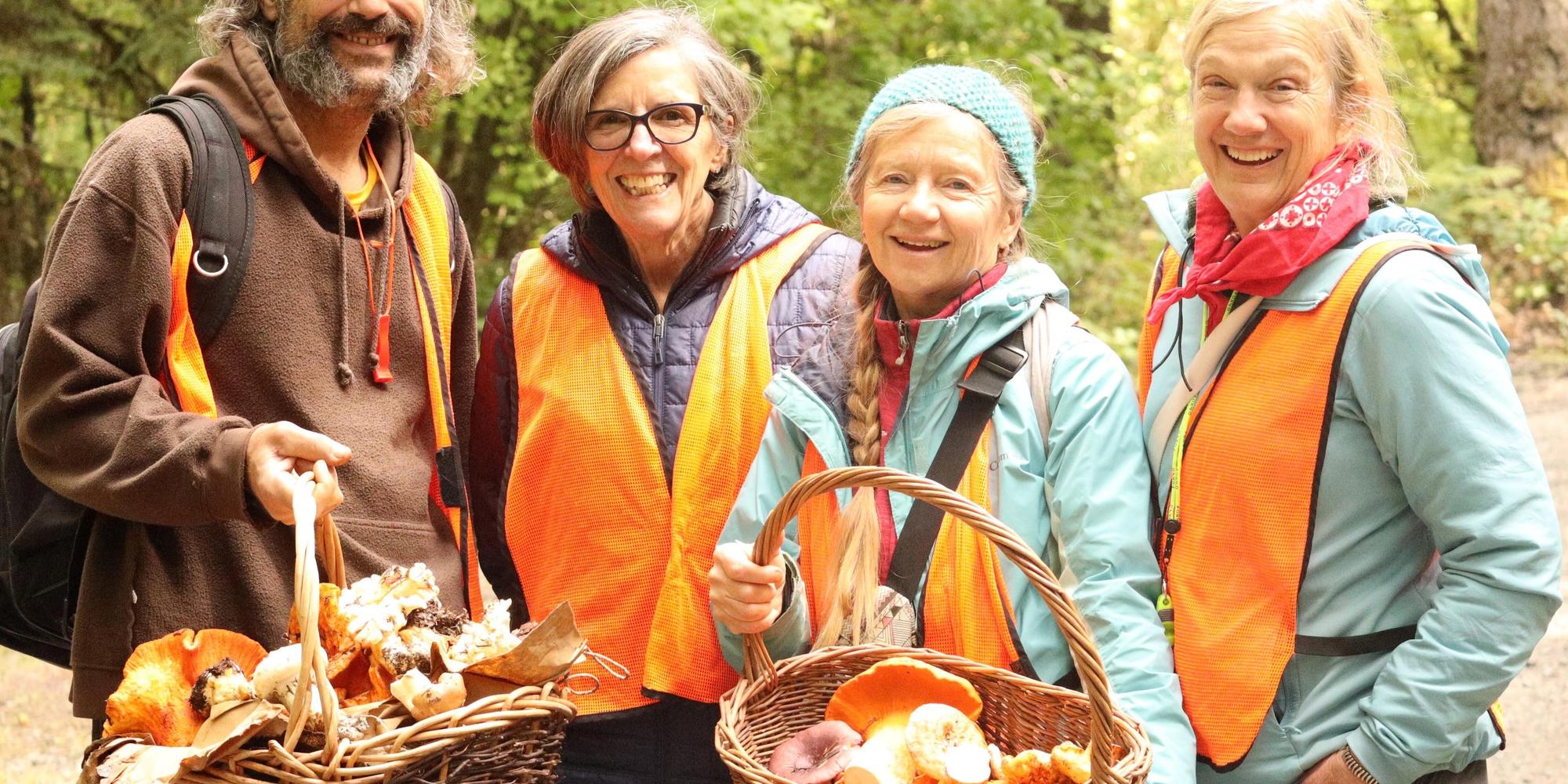 Happy foragers with their mushroom harvest near Mount St. Helens.