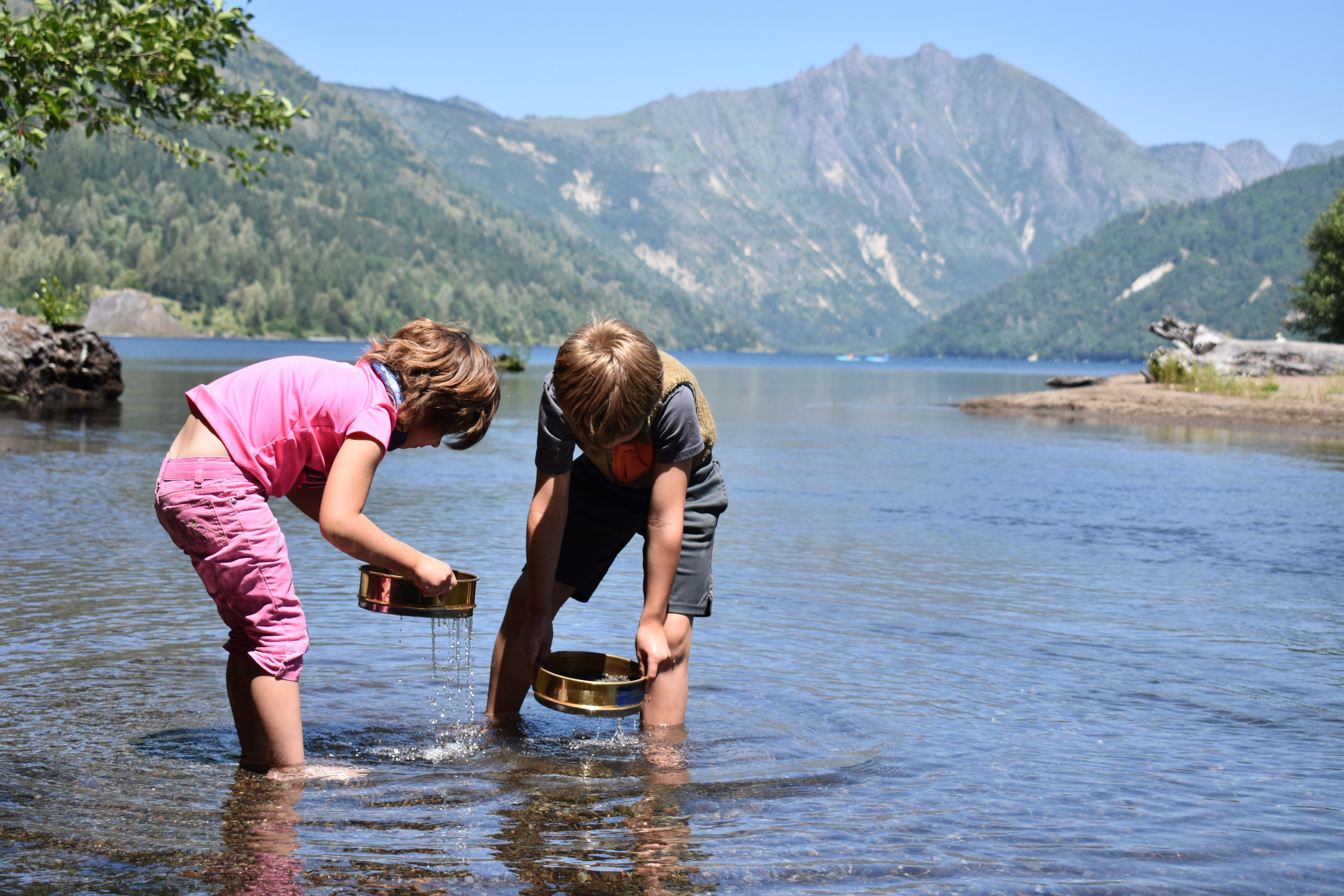 Youth exploring science in Coldwater Lake near Mount St. Helens