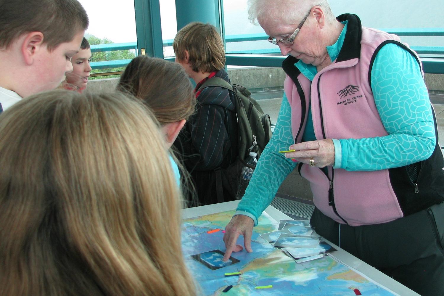 Volunteer with the Mount St. Helens Institute helps with an education program at the Science and Learning Center.