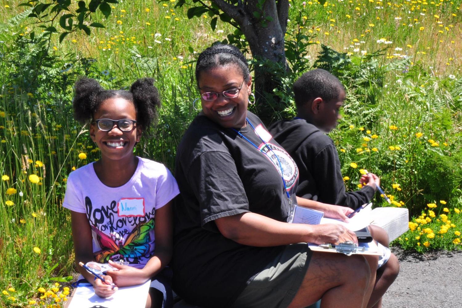 Mom and two kids learning with the Mount St. Helens Institute at a private family adventure
