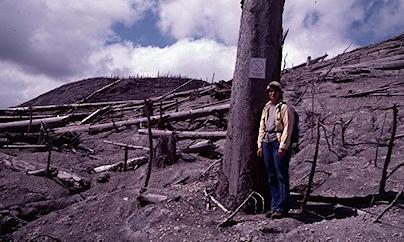 Susan at the Red Zone boundary two years after the 1980 eruption in July 1982, desolate surroundings and dead trees.