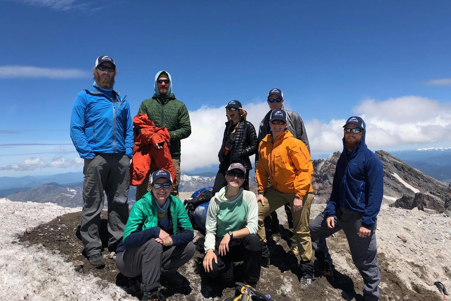 Satisfied hikers who have reached the summit of Mount St. Helens
