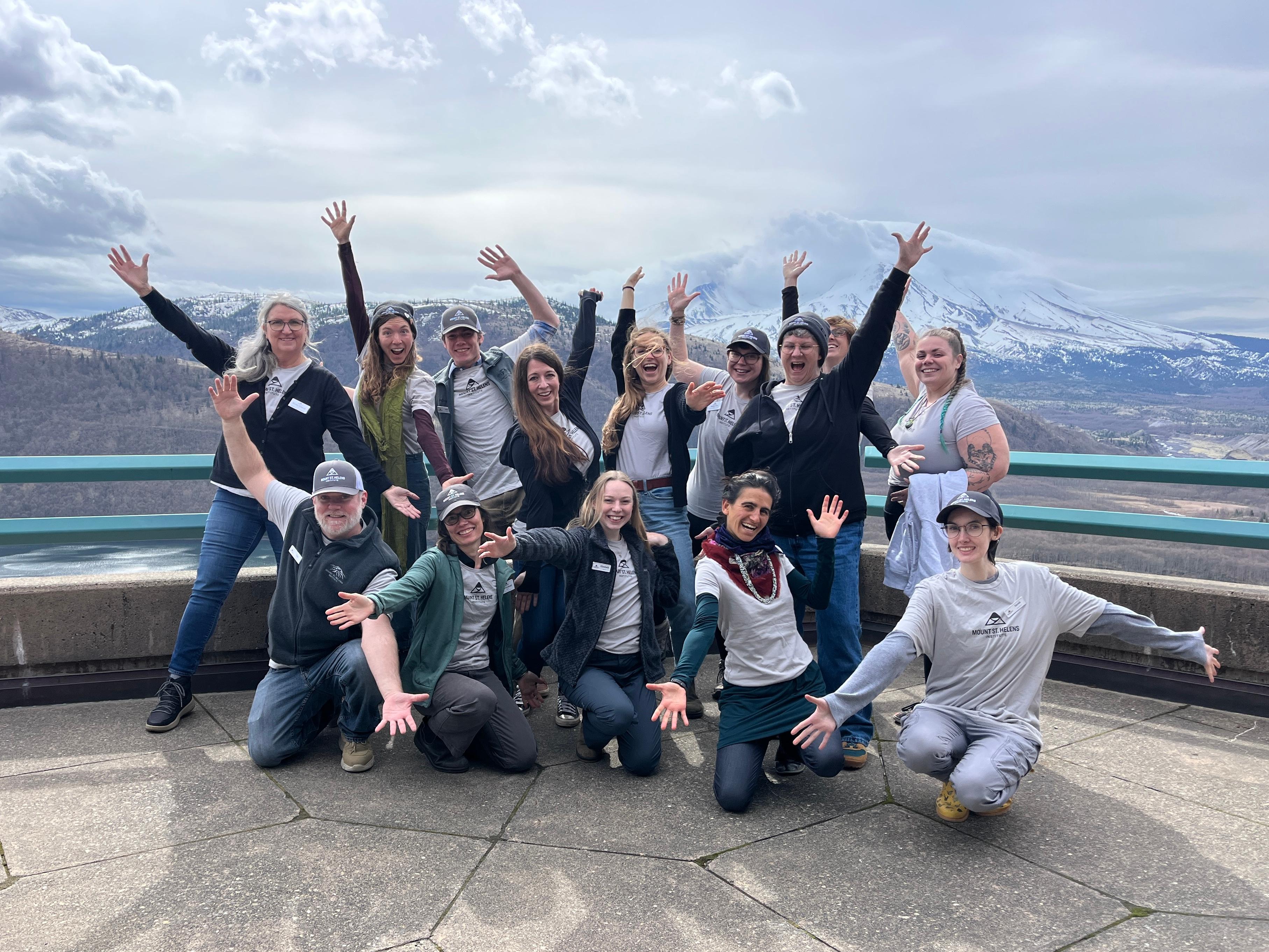 A group photo of team members in front of Mount St. Helens