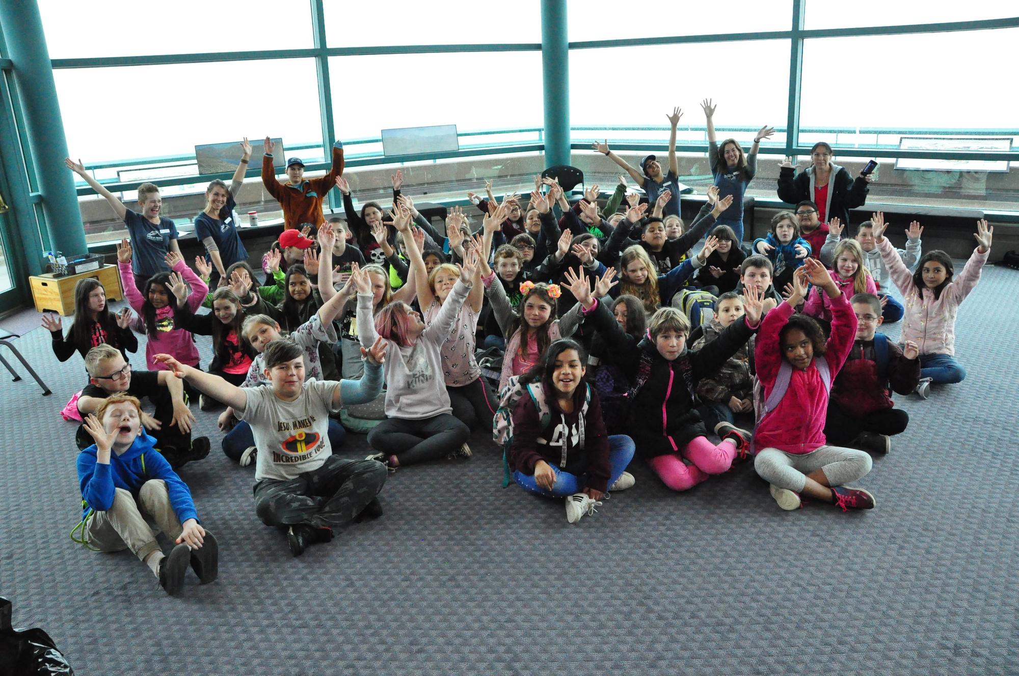 Happy group of students inside the Science and Learning Center at Coldwater near Mount St. Helens