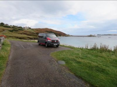 Fenyx parked by the sea in Lochivner on her NC500 adventure