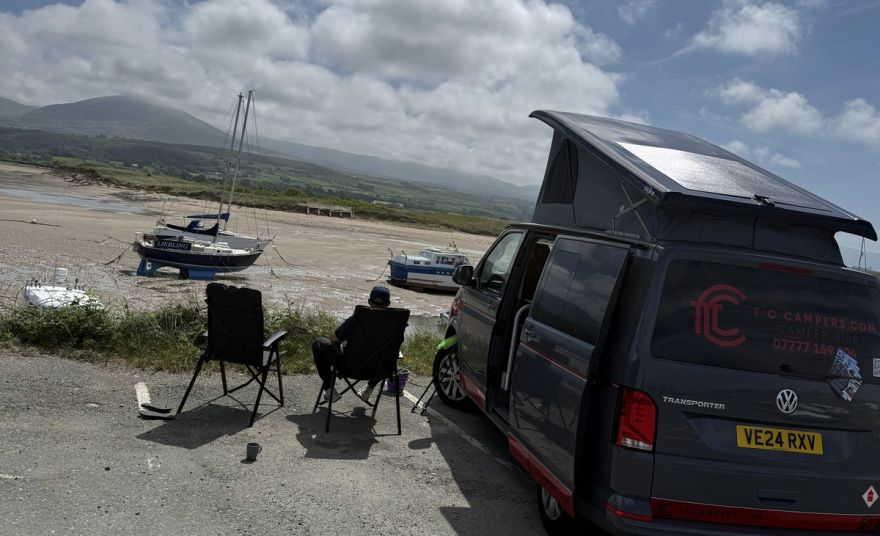 Fenyx parked by the harbour at low tide overlooking Snowdon Mountains