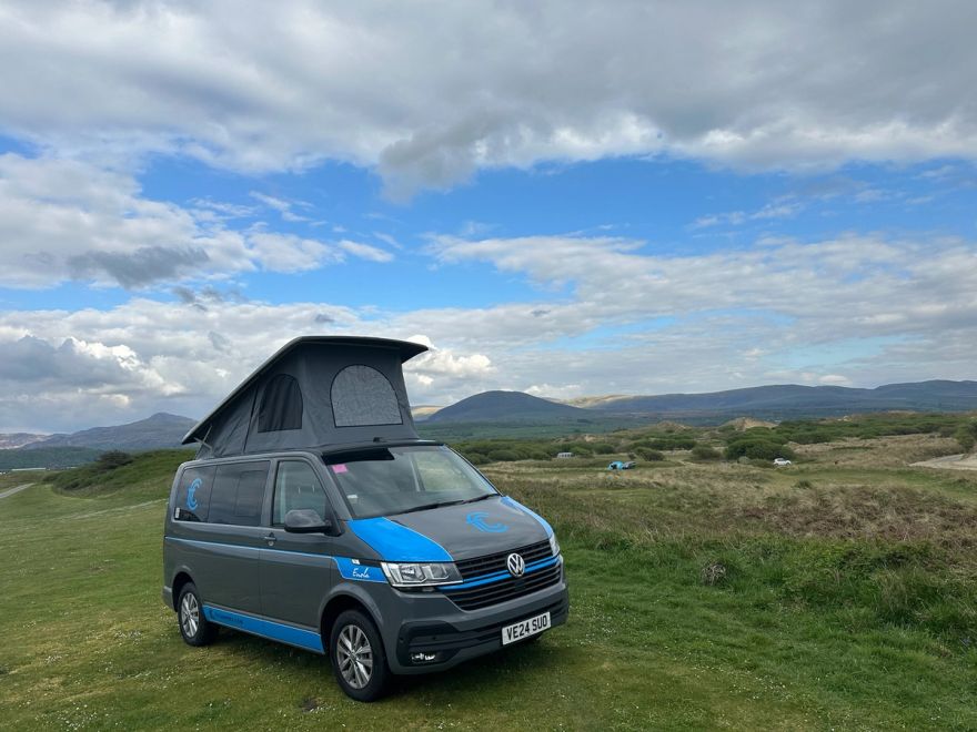 Enola parked up at the Shell Island, with Snowdonia at the background