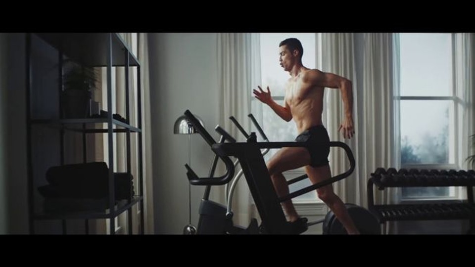 Cristiano Ronaldo sprinting on a treadmill in a gym, representing the commercialized athletic training contrasted with the football development discussed in this article.
