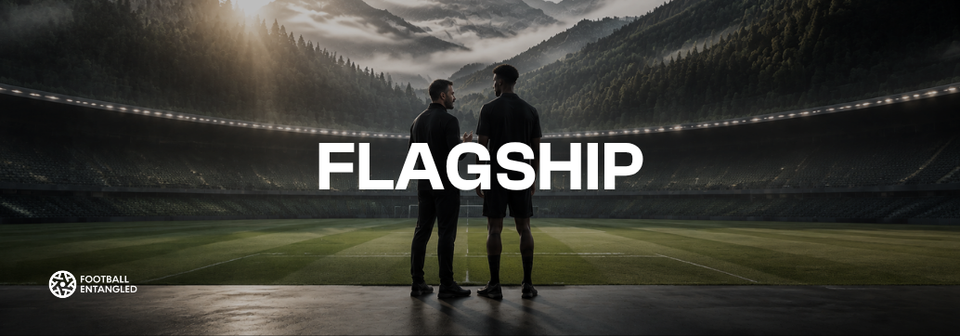 Total Footballer Flagship graphic showing a coach and footballer standing together on a stadium pitch, representing personalized development within Total Footballer 2.0.