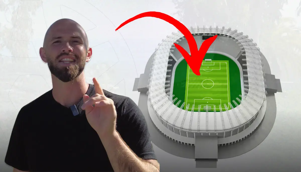 Football coach speaking beside an aerial stadium graphic, with a large red arrow pointing toward the football pitch to highlight tactical analysis and game strategy.