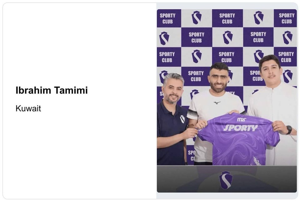 Ibrahim Tamimi poses with club officials while holding his new team's jersey after signing another professional contract in Kuwait.