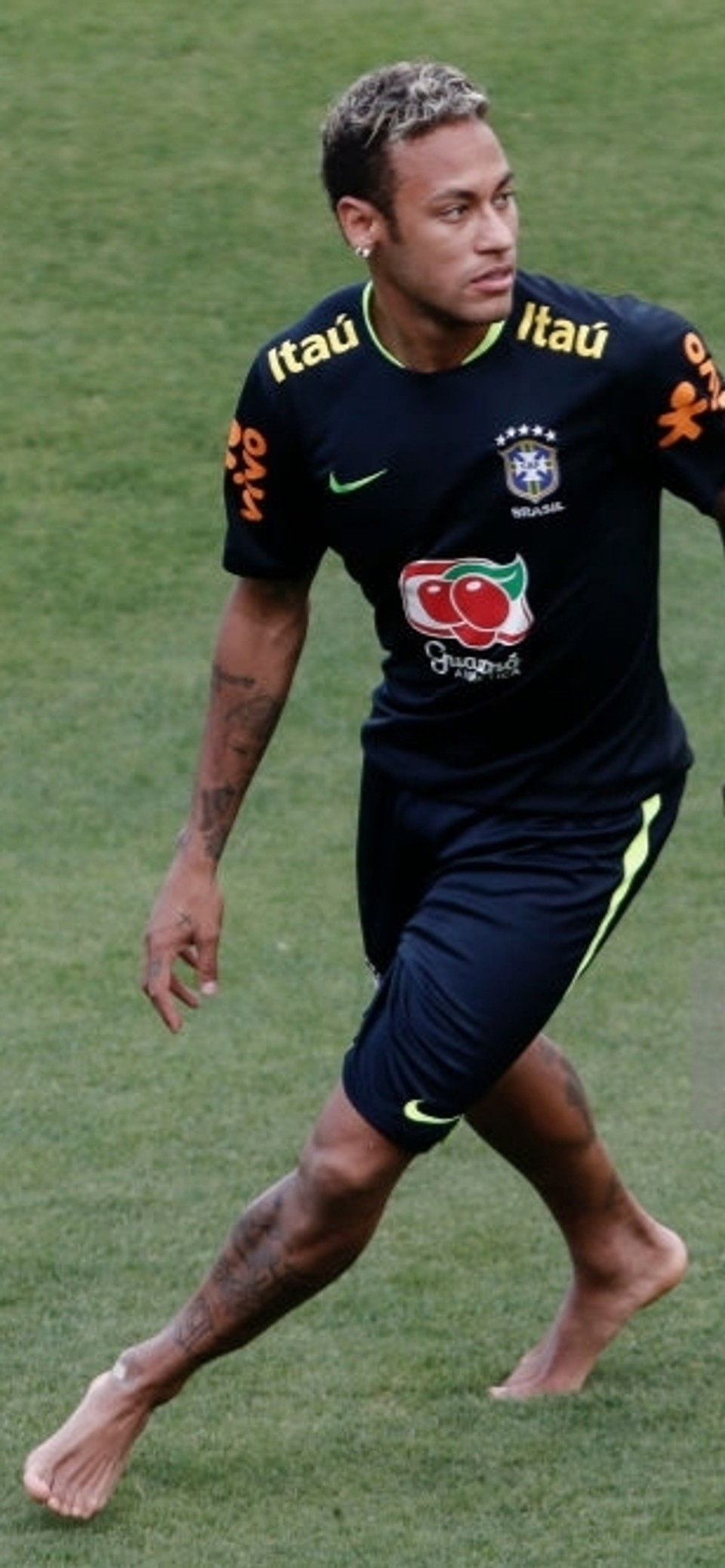 Neymar training barefoot with Brazil, illustrating the natural movement, foot mechanics, and athletic qualities associated with world-class footballers.
