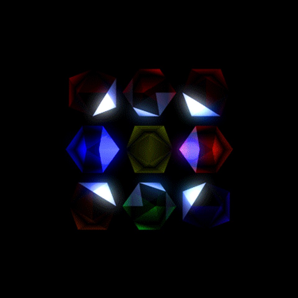 An abstract geometric pattern of glowing, multicolored polygonal shapes arranged in a grid against a black background, illustrating complexity emerging from simple repeating forms.