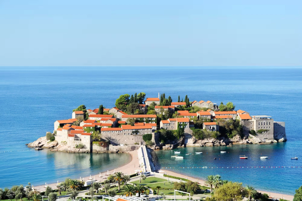 A town just off the coastline of montenegro, almost like ana island, showing the uniqueness of the country.