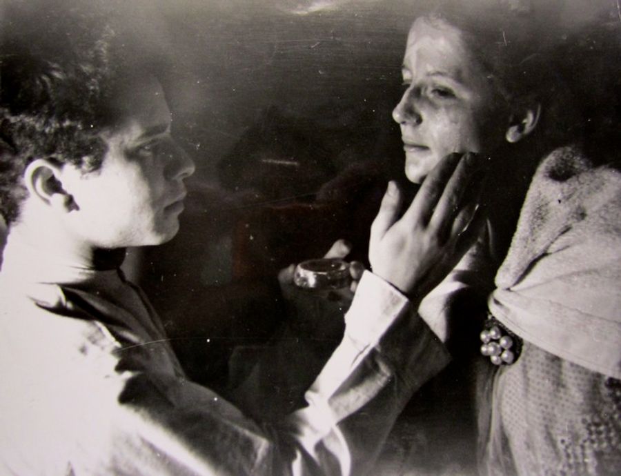 John Stix helping Anne "Nan" Chapin Weston with makeup for a dramatic performance.