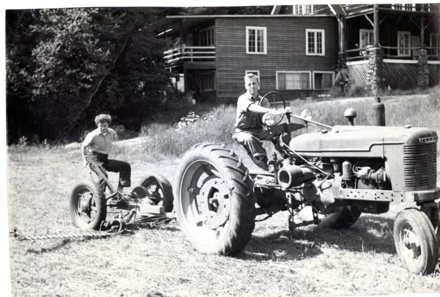 William Treichler driving tractor. 