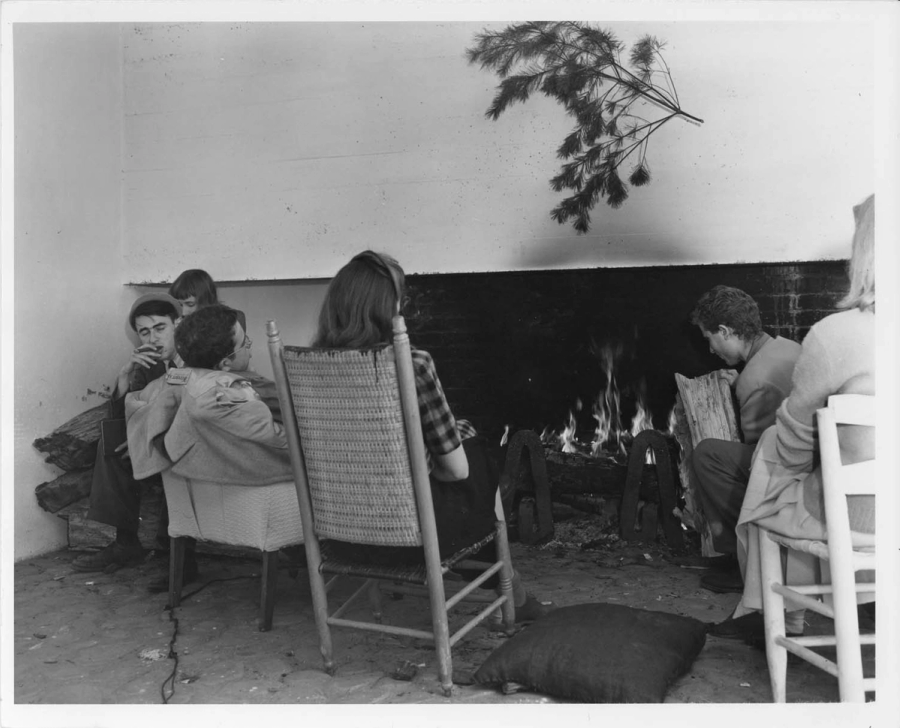 Students around the Studies Building fireplace, Lake Eden campus. 