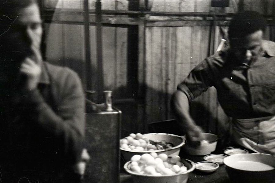 Nat Lytle (right) preparing eggs for unidentified student, 1937.