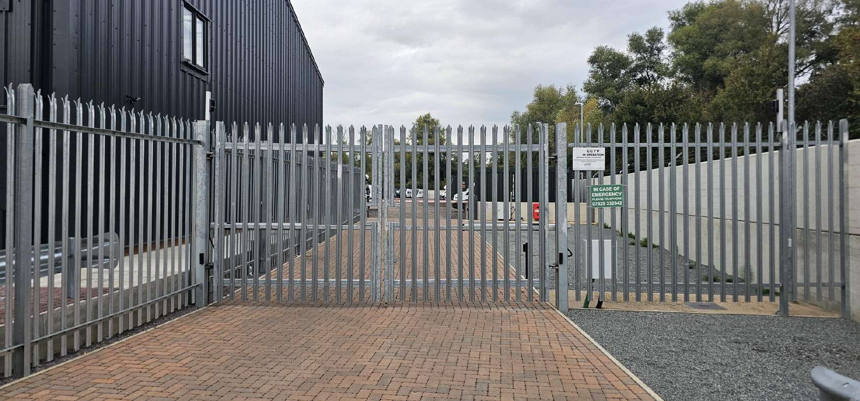 The inner gates of the airlock entry system, with CCTV in operation signs