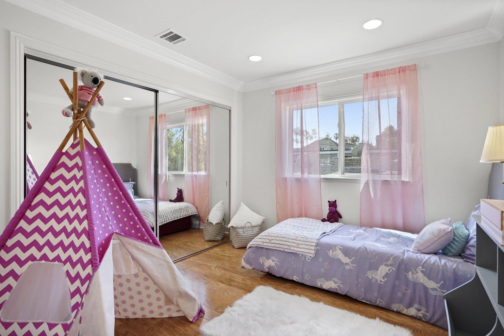 Kid's room with a pink play tent and purple bedding, Newport Beach