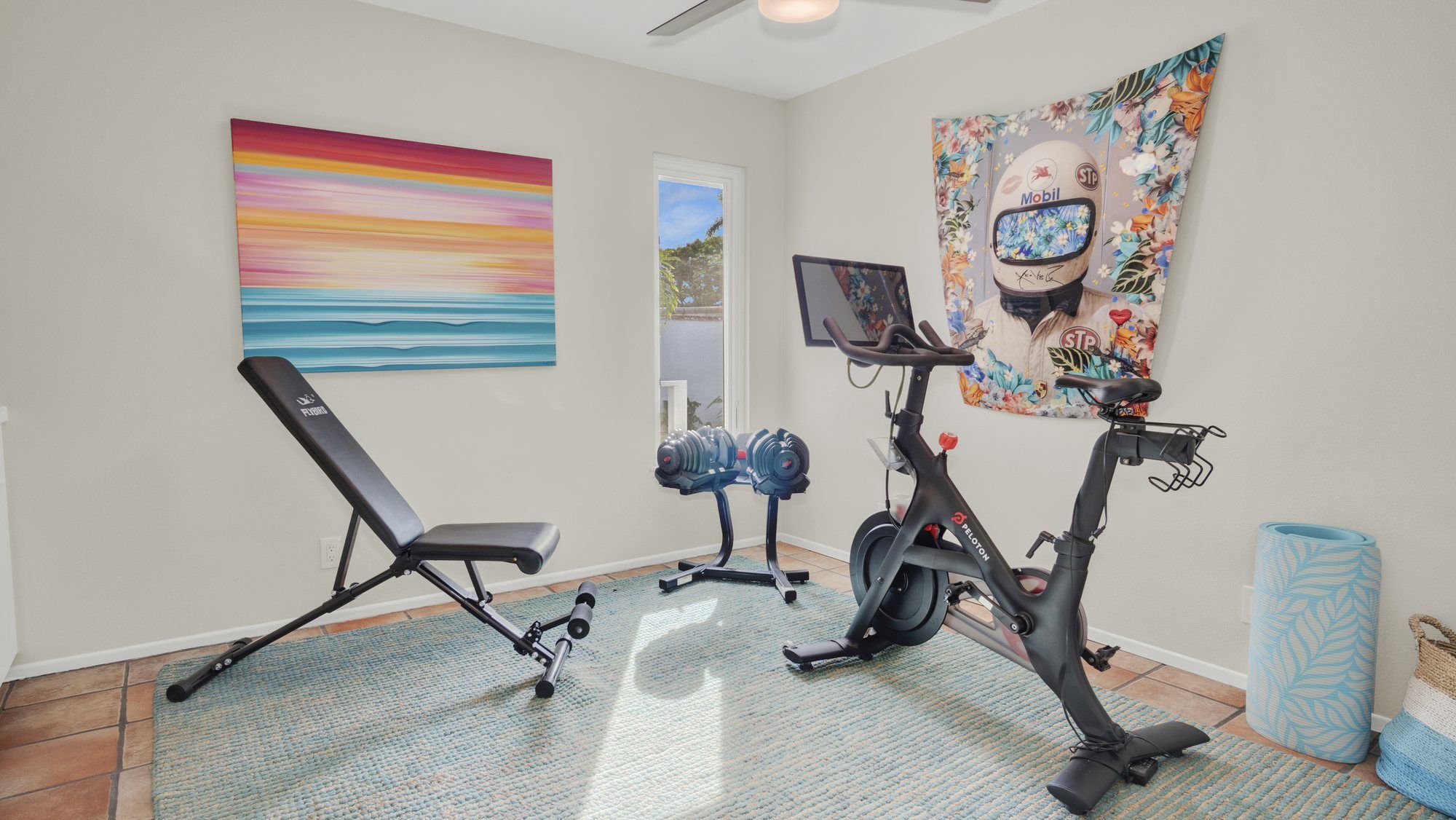 Spare room staged as a home gym with an exercise bike and a bench, Dana Point