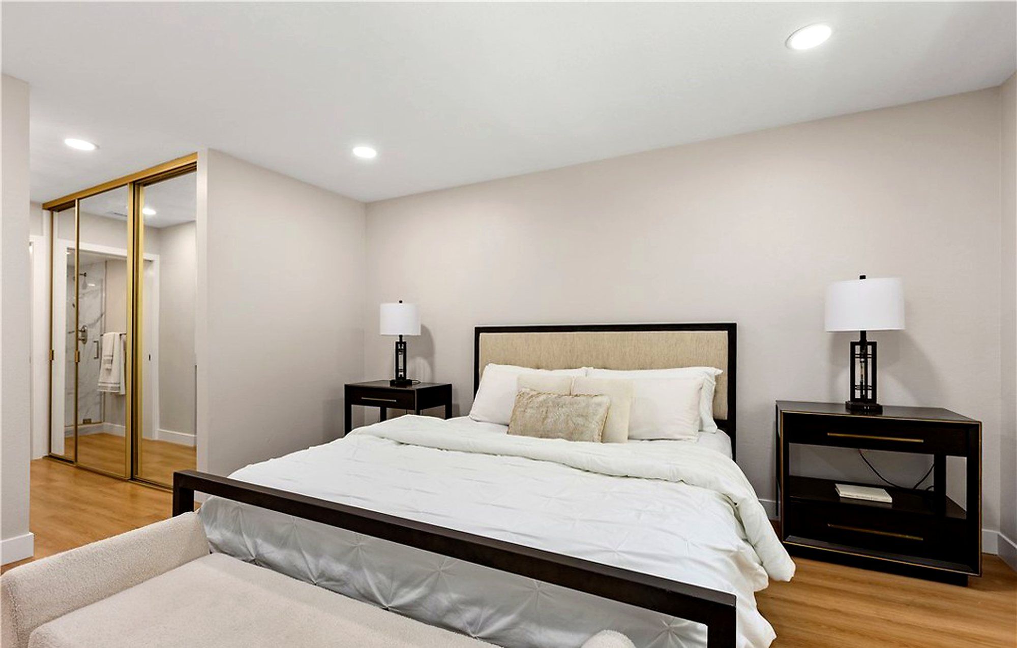 Bed with white bedding and black nightstands, Laguna Woods