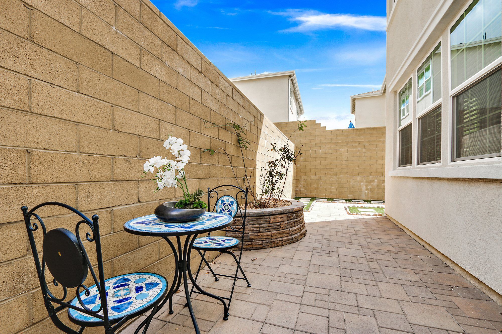Side patio with a mosaic bistro table and two chairs, Irvine
